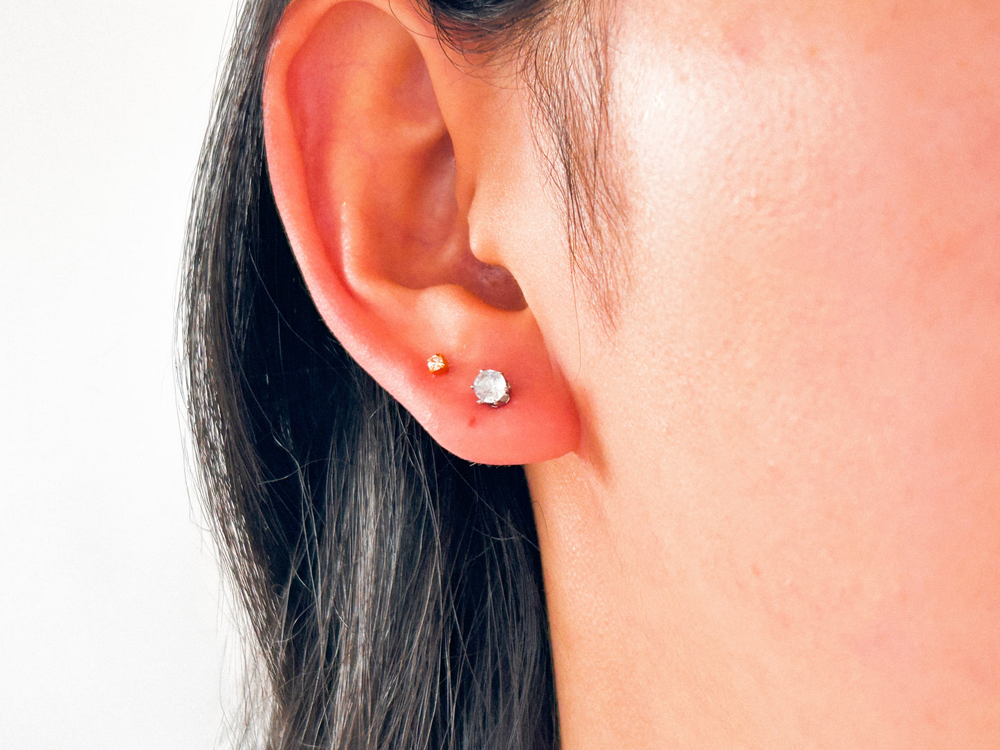 Brinco Ponto de Luz Zircônia Aço P